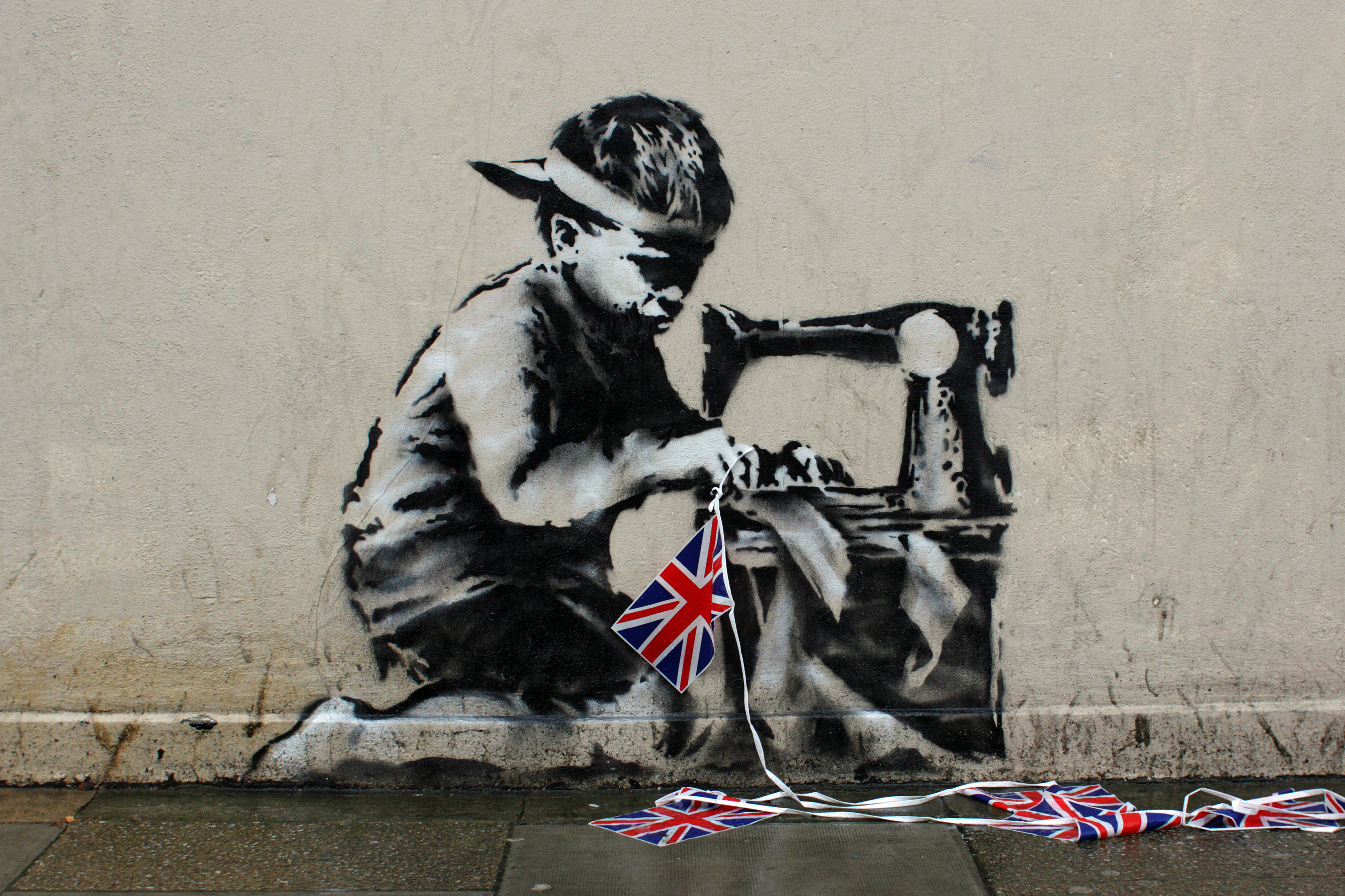 Mauerbild des englischen Straßenkünstlers Banksy in London
