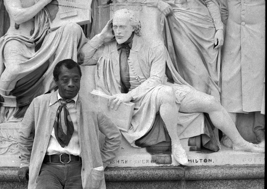 James Baldwin on the Albert Memorial with statue of Shakespeare