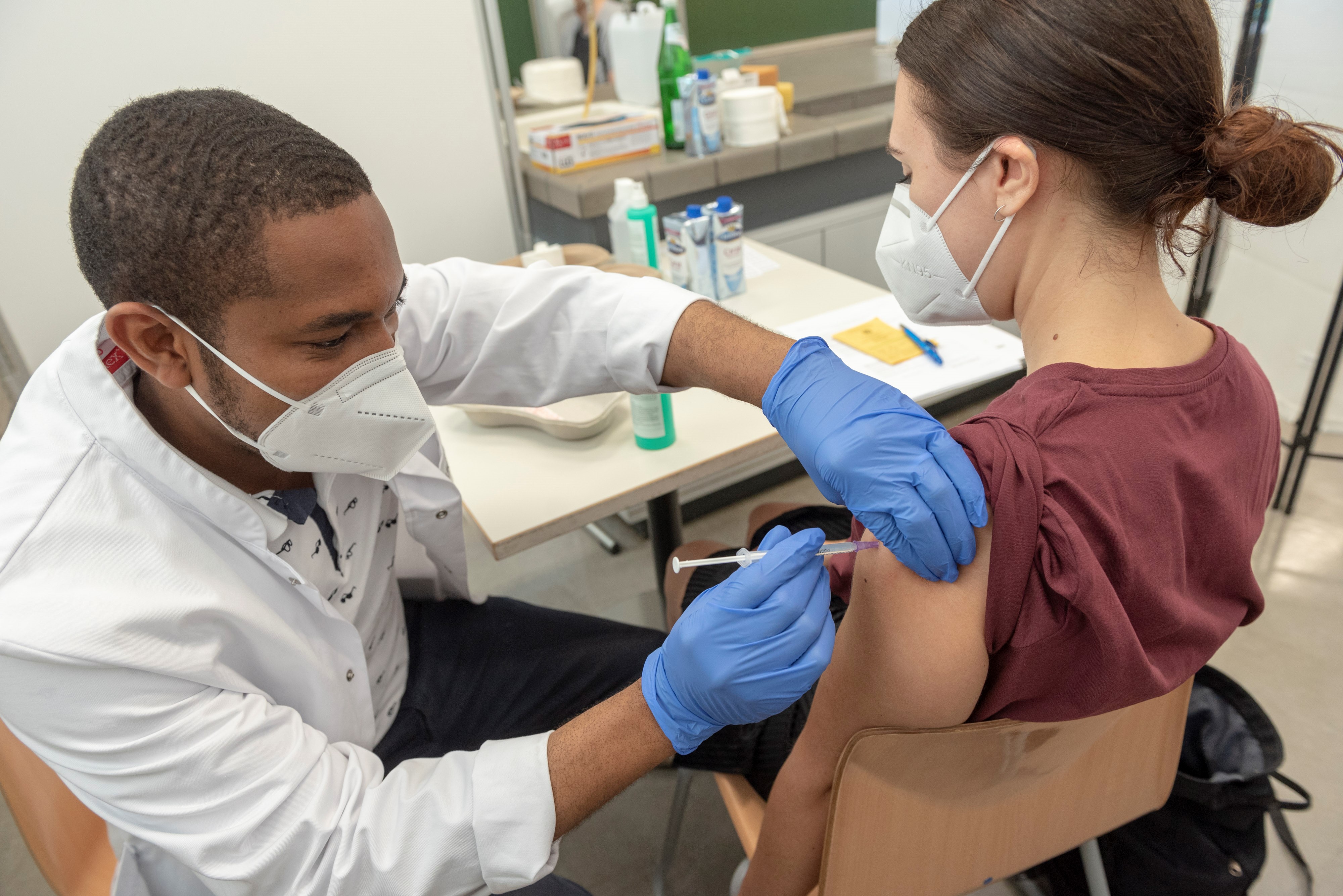 Female student getting vaccinated